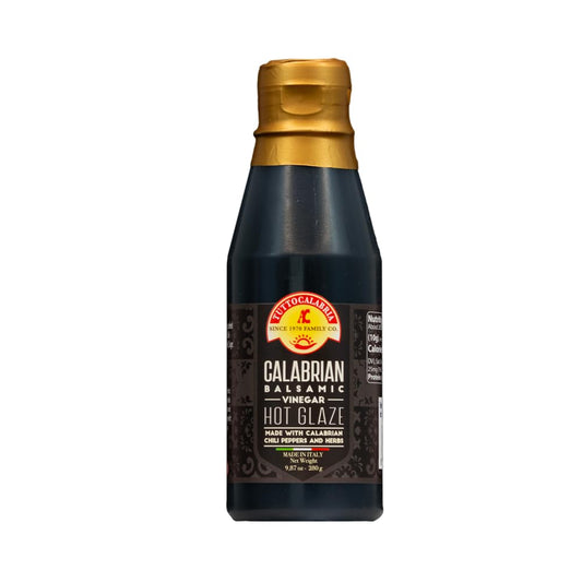 Bottle of TuttoCalabria Calabrian Hot Glaze with a gold cap on a white background