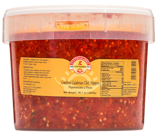 Container of crushed Calabrian chili peppers with a label on a white background