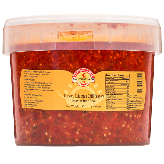 Container of crushed Calabrian chili peppers with a label on a white background