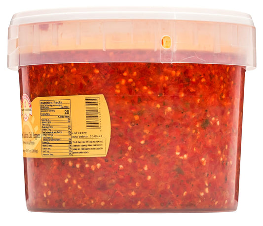 Container of red pepper flakes with a label on a white background