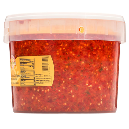 Container of red pepper flakes with a label on a white background