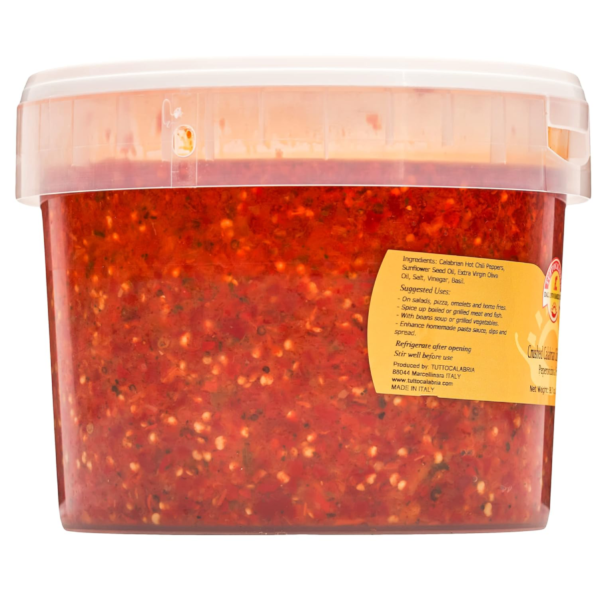 Container of red pepper flakes with a label on a white background