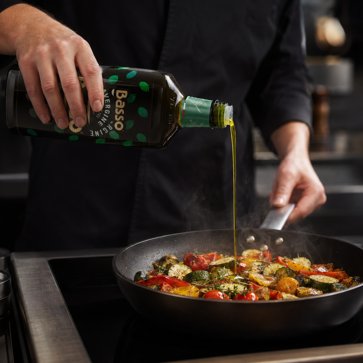 Chef using Basso Italian olive oil in a professional kitchen