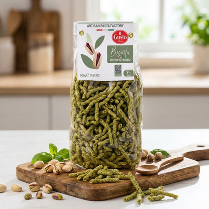 Packaged green pasta with a Gusto label on a wooden cutting board.