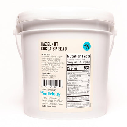 Container of hazelnut cocoa spread with Nutlicious branding and nutrition label.