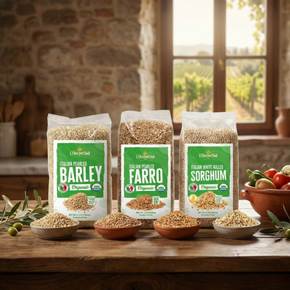 An Italian farmhouse-style display featuring organic pearled barley, farro, and sorghum grains with rustic bowls and countryside views.