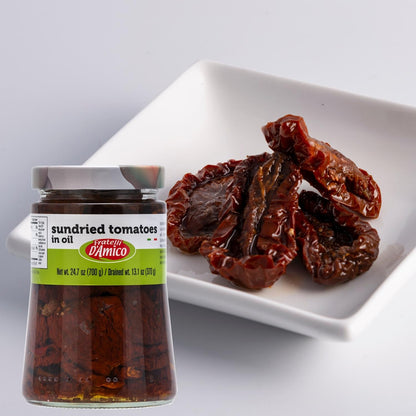 Fratelli D’Amico Sun-Dried Tomatoes in Oil, 24.7 oz (700 g) jar with drained weight of 13.1 oz (370 g), displayed next to a white dish holding several glossy sun-dried tomato halves